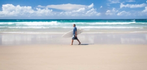 beach walking surfer